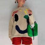 Clara | Pull Oversize Design Smiley Éclatant